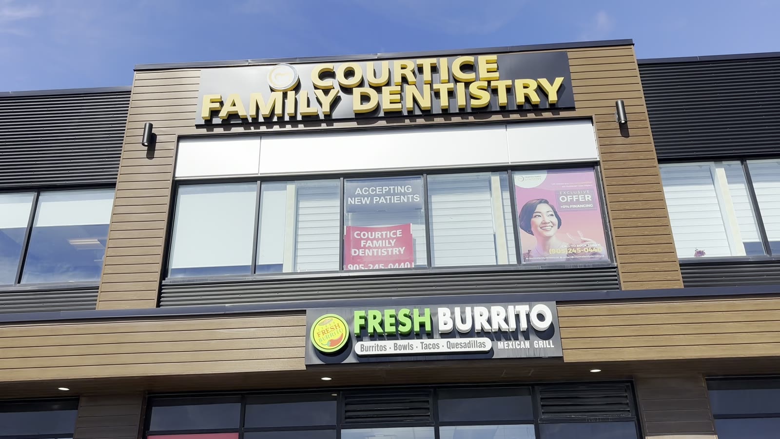 Courtice Family Dentistry sign on the building at 1635 Highway 2, above Fresh Burrito
