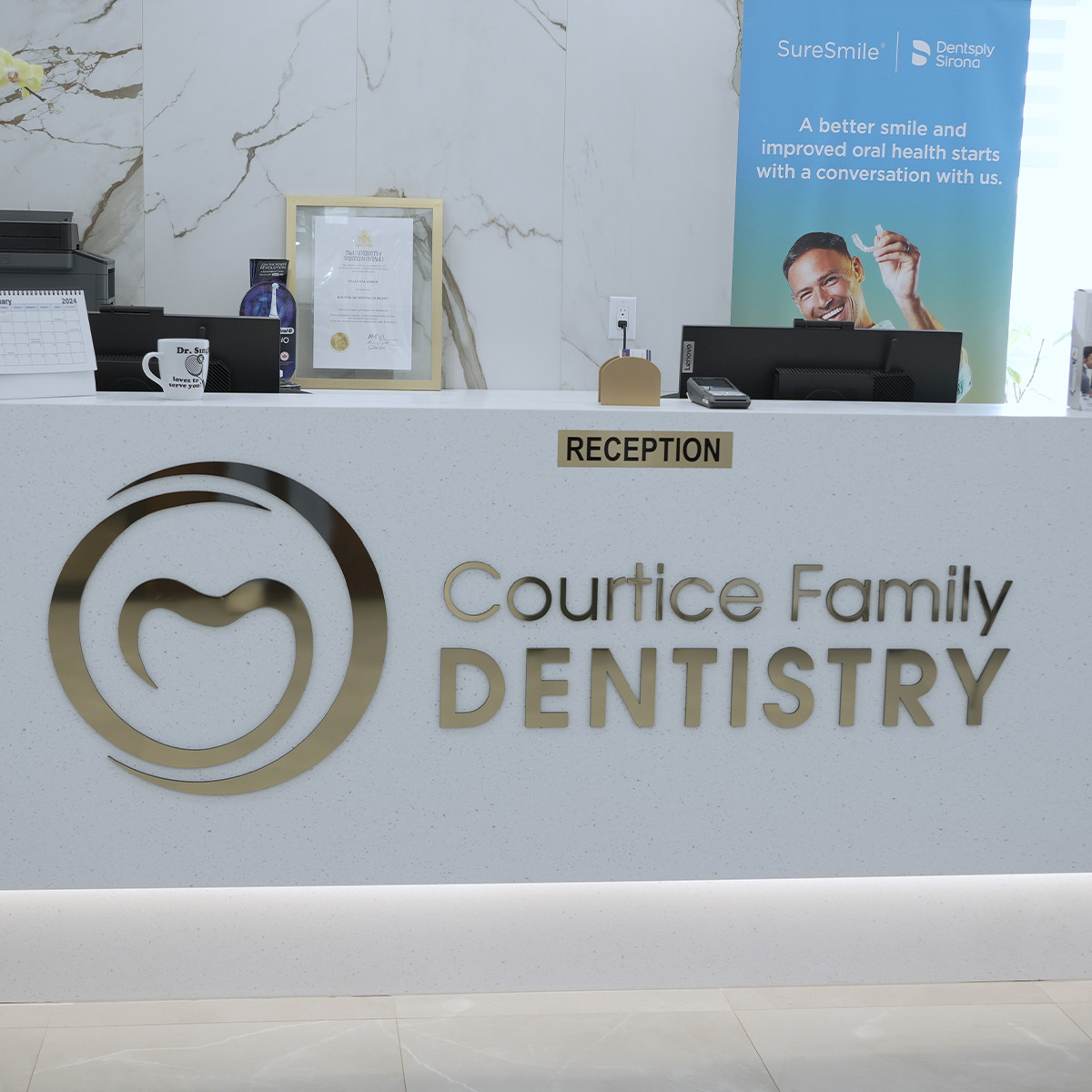 Reception desk with the Courtice Family Dentistry logo
